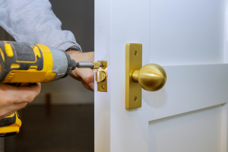 man drilling locks commercial locksmith services in mount dora, fl – rapid and reliable locksmith services for your office and business